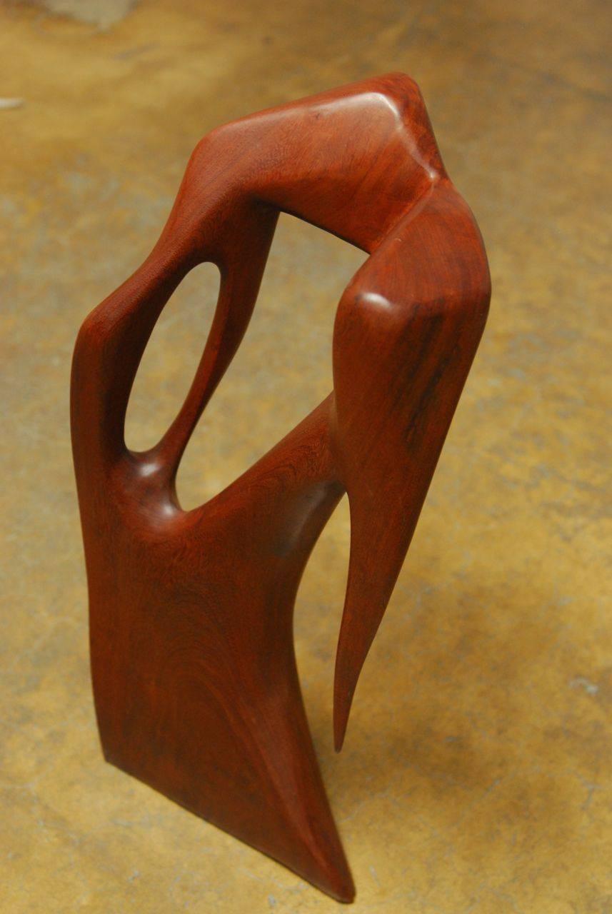 Dramatic abstract carving from the 1970s made from Ifit wood, native to Guam. Large and solid object with a biomorphic form. Artist unknown. Captivating from any side or angle.
