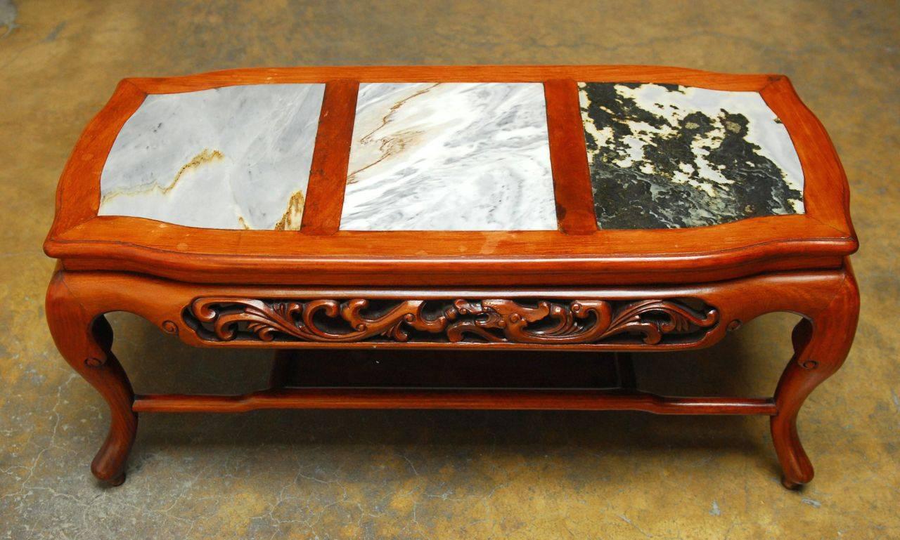 Hand-carved Chinese hardwood coffee table featuring three marble Dali or dream stone panels meant to inspire scholarly thought and reflection. High relief carvings on both sides and supported by cabriole legs with humpback stretchers and a bottom