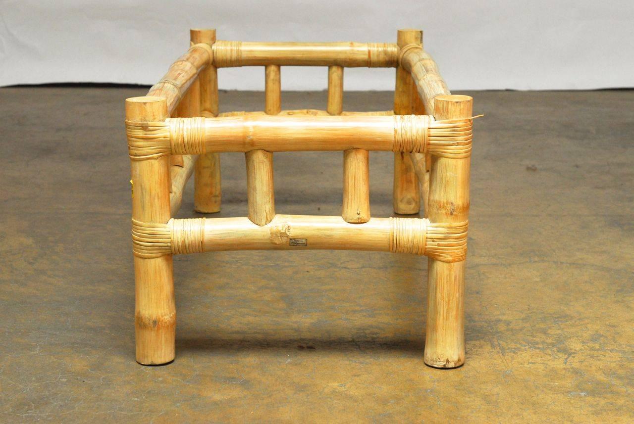Thick, natural bamboo stalks form an open frame for this organic table supported by larger round bamboo legs. Whitewashed and strapped with rattan binds. Glass top not included. Produced by O-Asian of California, the producer of the Ralph Lauren