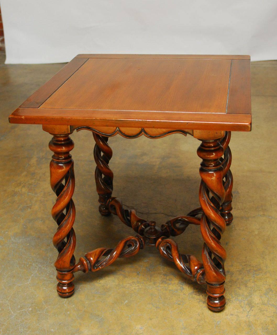 Impressive carved square center table featuring an open barley twist style legs and stretchers, terminating in a small center finial. Made in the Louis XIII style with a shaped apron. Unique reinterpretation of a Classic table with superior