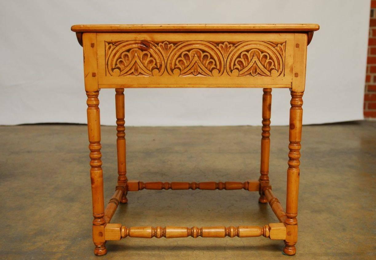 This contemporary rustic re-interpretation of the Classic bible box is hand-carved with a finely distressed finish for a period look. Constructed with wood peg joinery from European pine. Supported by turned legs and stretchers featuring a flip-top