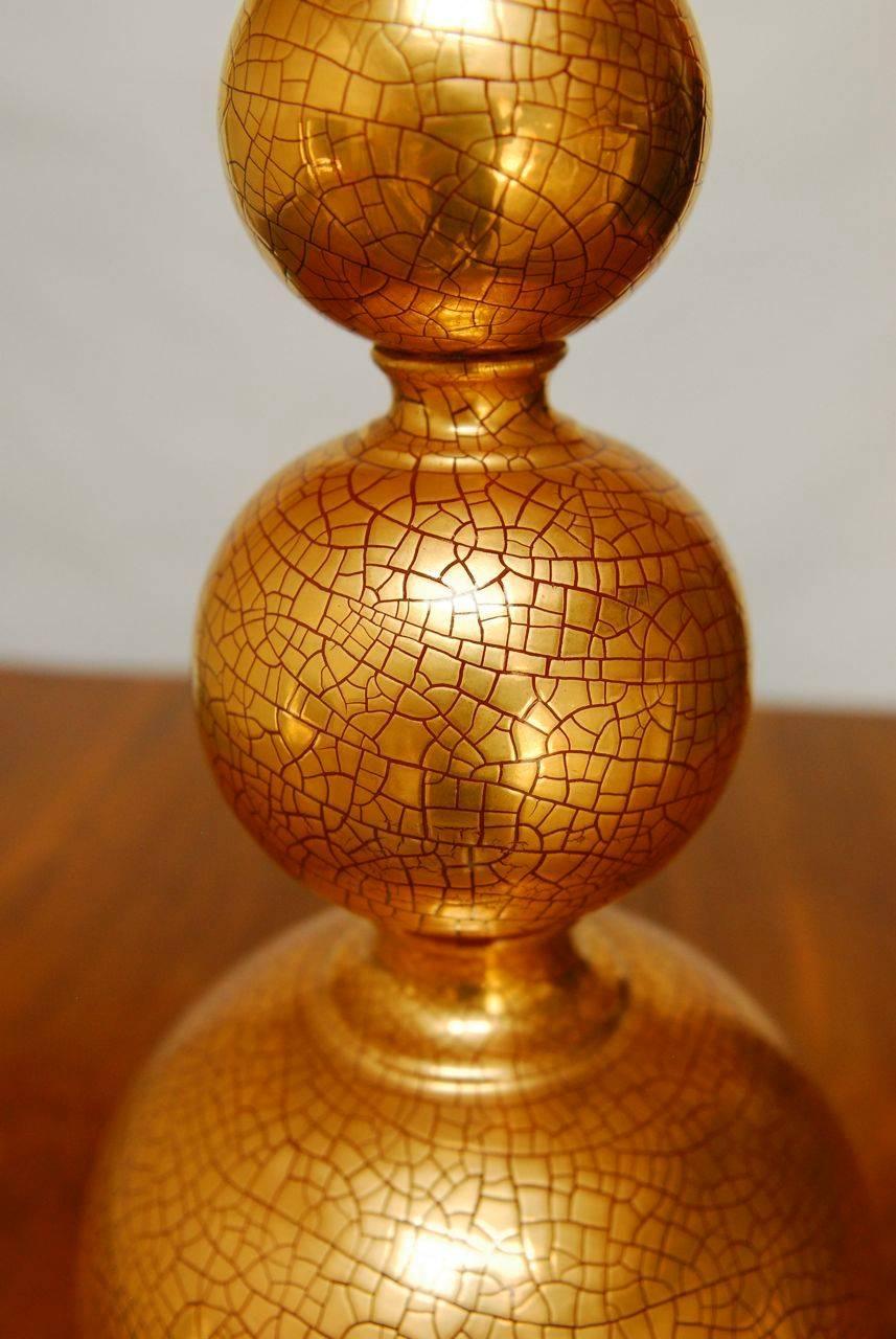 Chic stacked ball table lamp with copper patinated crackle finish. The orbs are exceptional metal castings with finely detailed recessed relief texture. Base and finial are gilt in copper tones matching the lamp. Made by Marbro Lamp Co.