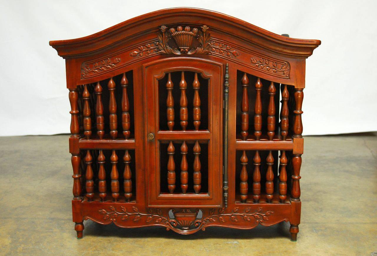 Pair of beautifully carved matching mahogany cupboards with domed tops featuring turned spindle sides and fronts with intricate carvings. Made to store bread. These boxes could be displayed on a table or hung on a wall. These are highly ornate
