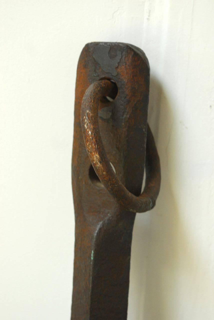 Extraordinary ships anchor with a heavily patinated finish on the cast iron. Very solid heavy anchor that is sea worn and still has the shackle or ring. Handsome display piece with traditional diamond shaped blades on the crown. Large enough for an