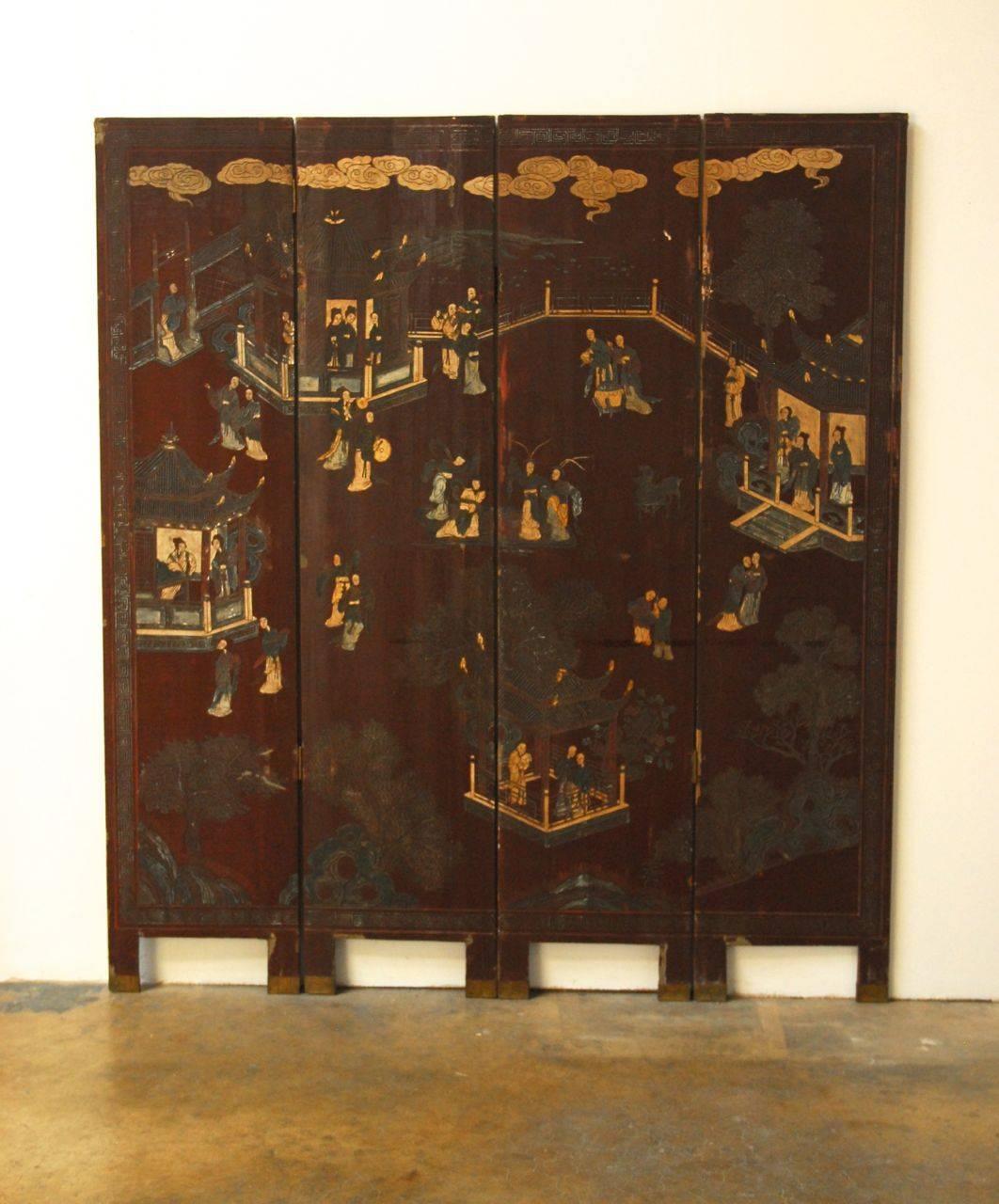 Rare, red lacquered Chinese coromandel screen that has faded into a rich plum color and patina. Four panel, double-sided screen featuring beauties in a courtyard surrounded by pagodas and trees on one side with a Greek key border. The reverse side