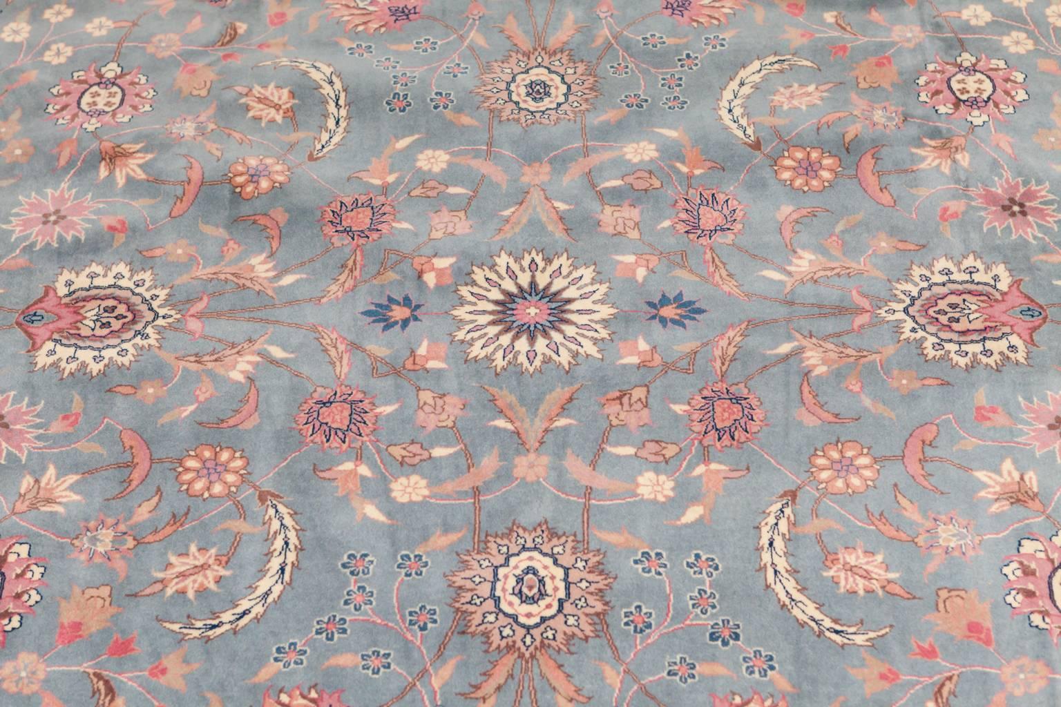 Spectacular powder blue Indian Agra rug featuring vines and floral motif on a rare light blue ground with a cream border. Highly sought after Agra rugs are extremely well made and feature a long pile making them durable and heavy. This whole room