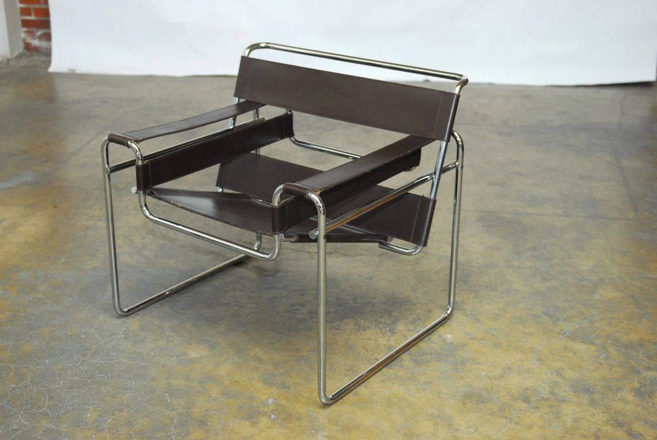 Authentic Marcel Breuer designed Wassily chair made in Italy for Stendig. Features chrome tube construction with smooth chrome tube ends and thick brown belting leather straps. Stamped with Stendig label on bottom and in excellent condition with