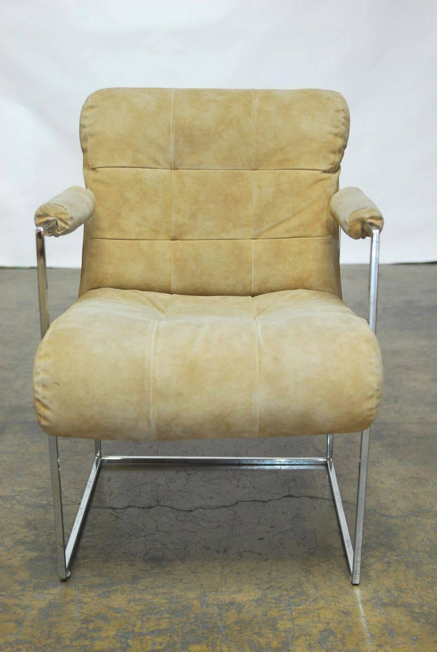 Iconic set of chrome armchairs designed by Milo Baughman for Thayer Coggin featuring thin line chrome frames with thick padded upholstery and padded arms. Thayer Coggin labels on bottom of chairs with original vintage upholstery. Rare style with