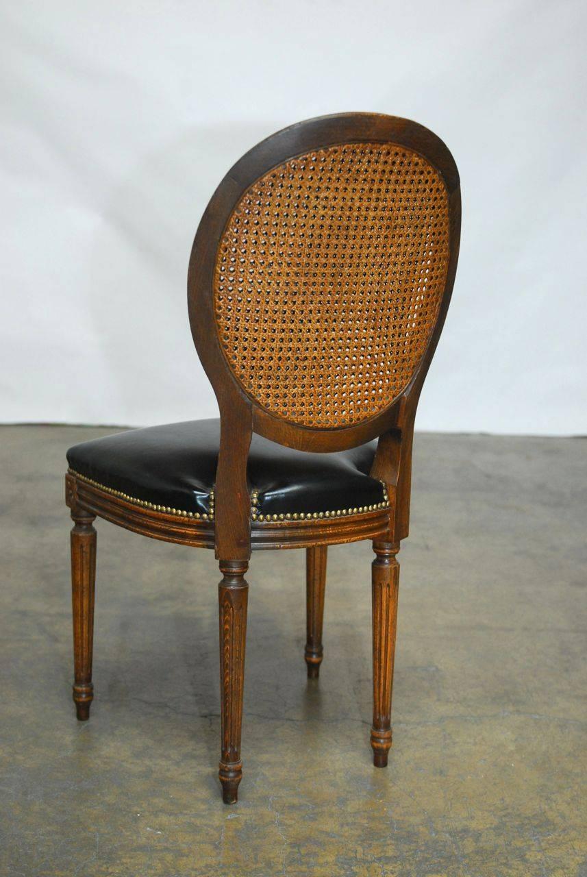 Set of Four Louis XVI Leather and Cane Dining Chairs 1