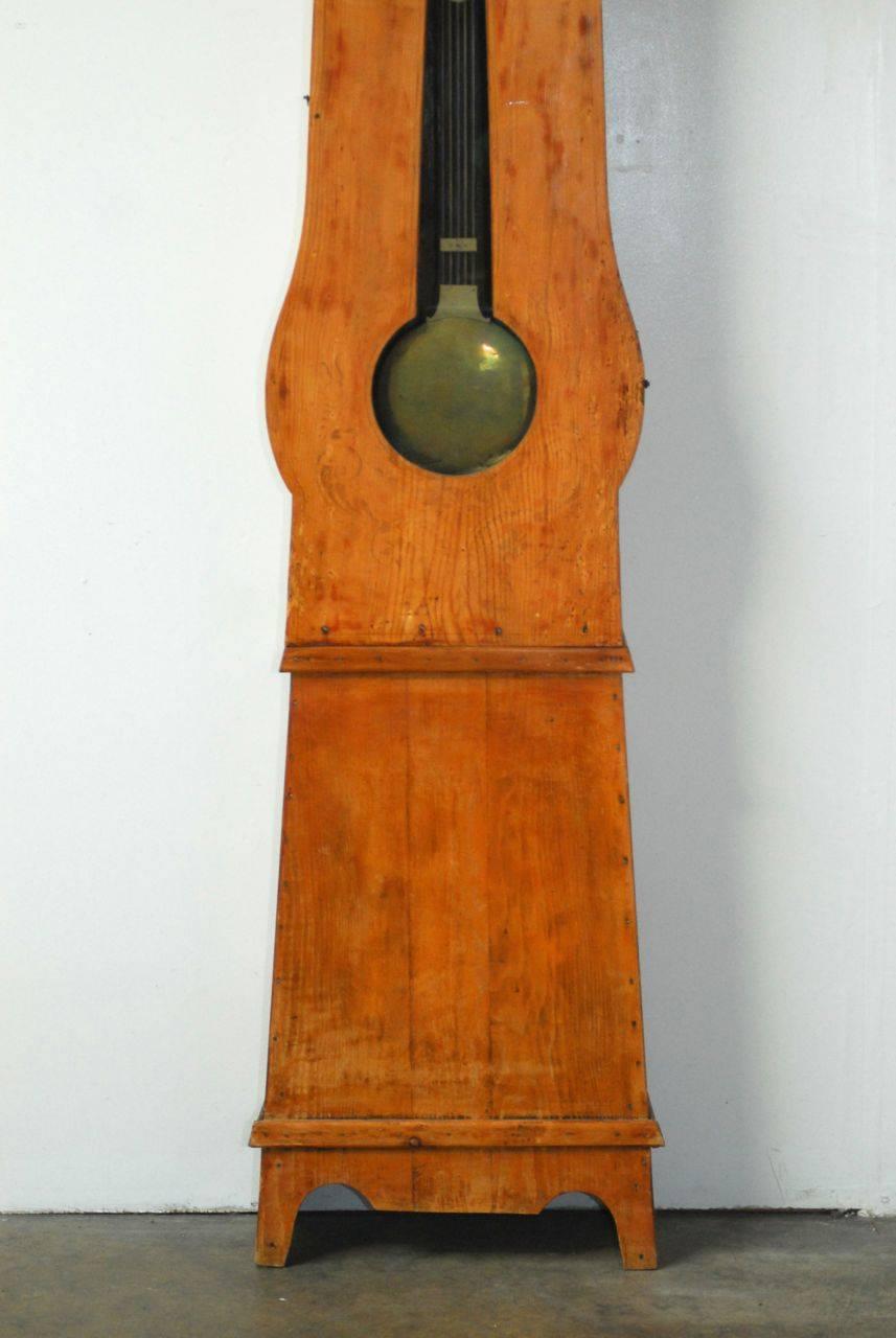 Rustic 19th Century French Morbier Case Clock with Brass Repousse Face