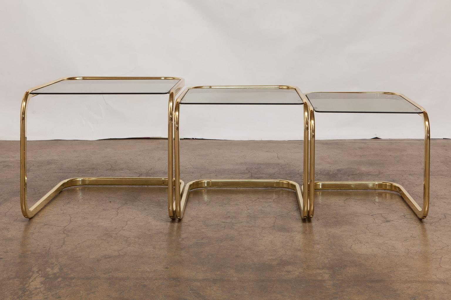 Hollywood Regency Set of Three Brass and Glass Nesting Tables by Milo Baughman