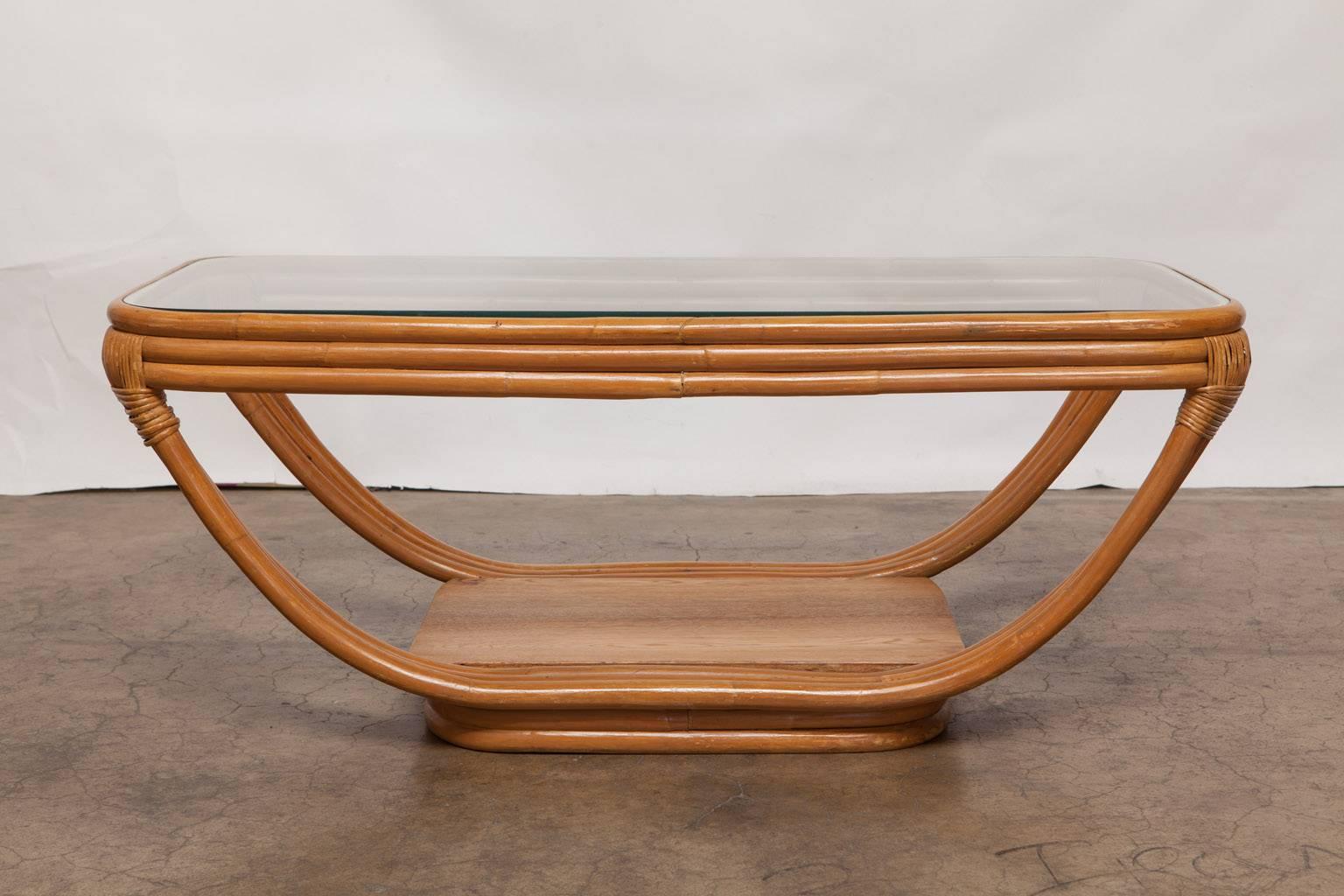 Rare rattan sculptural coffee table by Kosuga for Paul Frankl. Made in Tokyo, Japan featuring authentic steam bent rattan. Ordered from the manufacturer with original brochure. Made in the Art Deco period and purchased from the original owner.