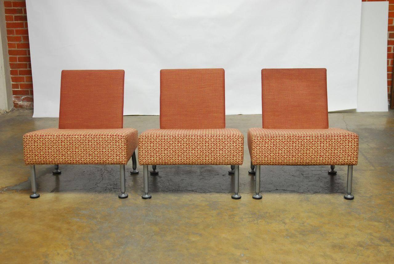 Unique set of Brayton International lounge chairs featuring steel legs and an upholstered seat with a thick cushion and flat back. Rare modern style with a whimsical look and profile.