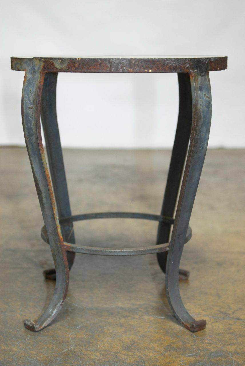 Vintage French marble-top drink table featuring a wrought iron base with a patinated rustic finish. The marble is supported by an iron ring connected to cabriole style legs with scrolled feet and a round ring stretcher.