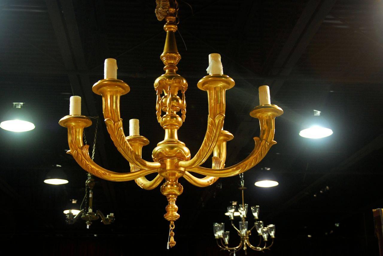 Monumental ballroom sized giltwood six-light chandelier handmade in the Rococo taste by Rose Tarlow Melrose House in Los Angeles, CA. This palatial chandelier demands your attention and is adorned with acanthus decorated arms and hanging tassels.
