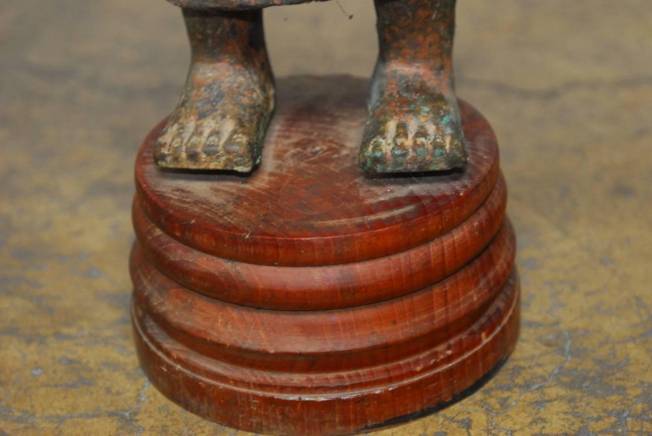 Cast Iron Standing Buddha on Stand In Distressed Condition For Sale In Rio Vista, CA