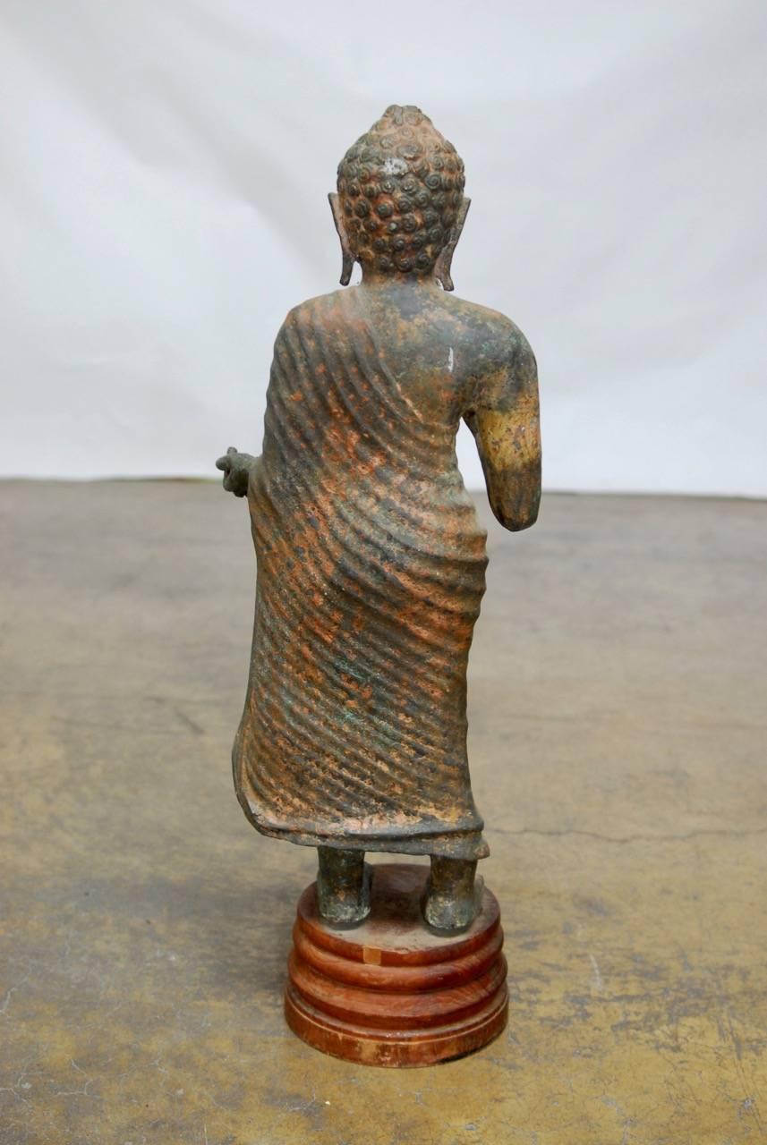 Cast Iron Standing Buddha on Stand For Sale 1