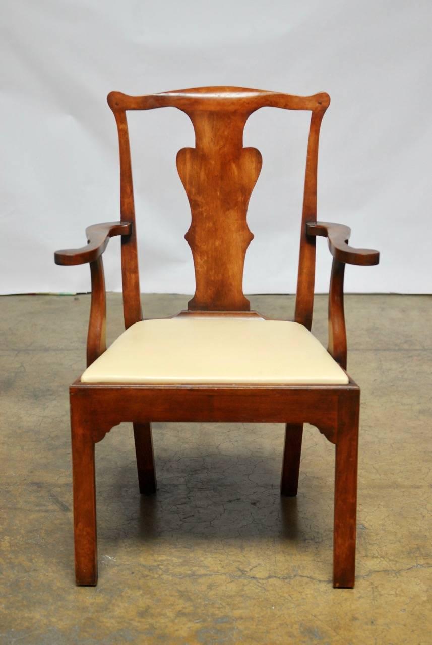 Remarkable set of six dining chairs made from walnut in the George III taste and all six being armchairs. Featuring a distinctive solid backsplat topped by a shaped crest rail. Constructed with wood peg joinery and supported by square legs free from