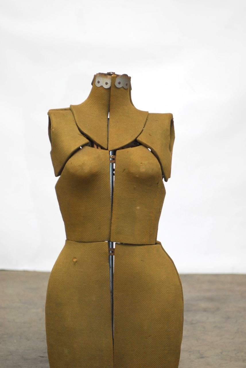 Vintage adjustable dress form mannequin that opens for different sizes.