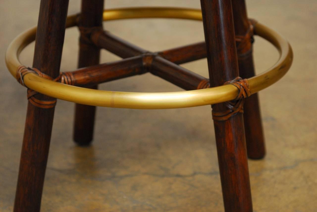 American Pair of McGuire Bamboo Rattan and Leather Swivel Barstools