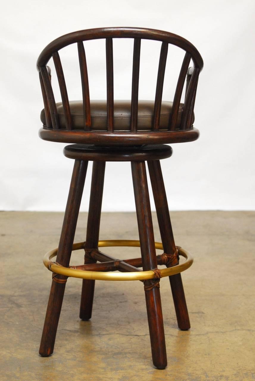 20th Century Pair of McGuire Bamboo Rattan and Leather Swivel Barstools