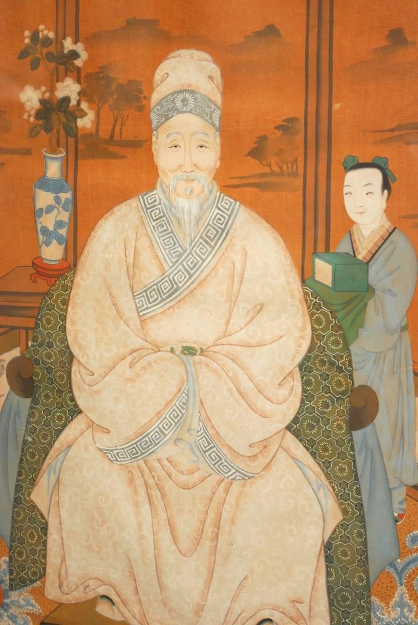 Colorful Chinese watercolor on silk painting of a patriarch depicted seated in a robe in front of a large screen. Wonderful use of blue color is featured on the intricate floral carpet and Ming vase and robes. The ancestral portrait is bordered by a