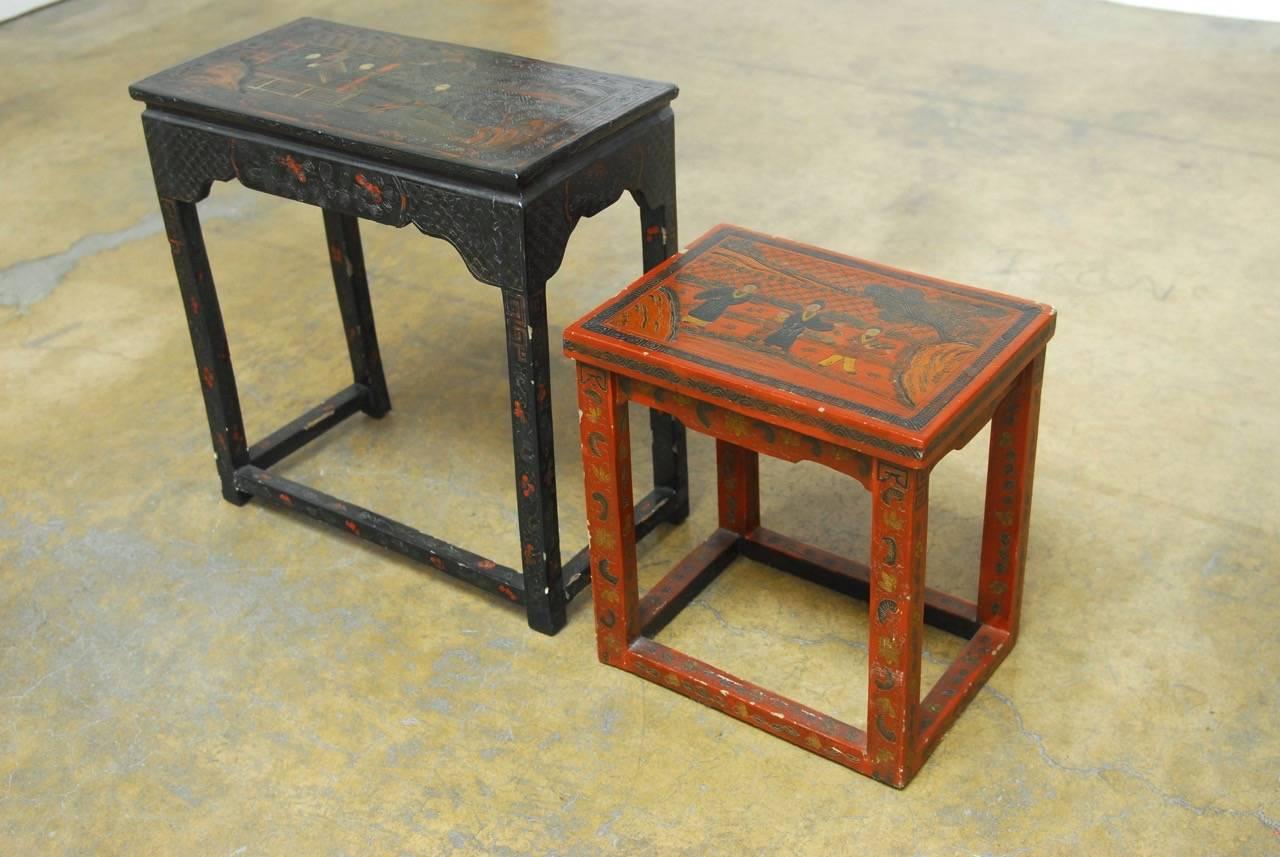 Rare pair of Chinese lacquered tables made in the coromandel style with thick lacquer finish that is carved and decorated. Each table has idyllic scenes on the top panel and are supported by square legs. One black table and one red table. The latter