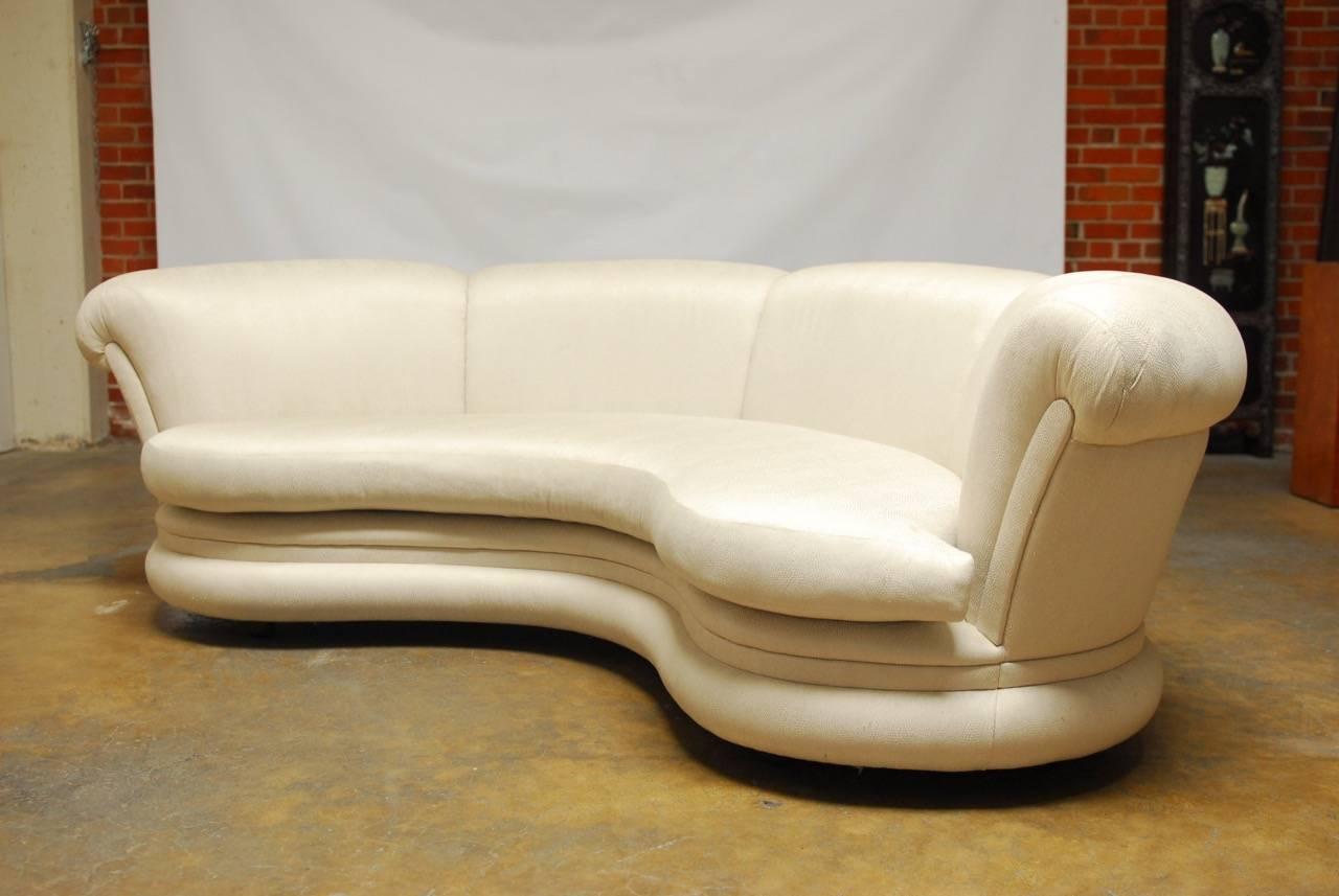 Stylish modern cloud style sofa in a curvilinear form featuring a soft shimmery fabric with a snake skin texture. Custom-made at the San Francisco design Center for a local Bay Area estate. Deep padded back, seat cushion, and padded base with a