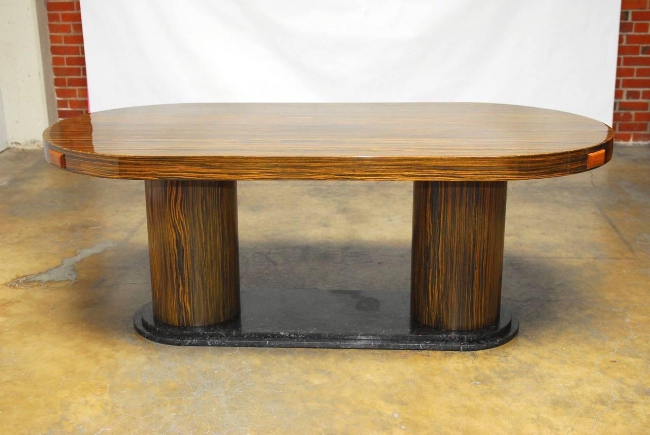 Exquisite Italian zebrawood conference table made in the modern style with two large round pedestals mounted to a stepped marble base. Finished in a high gloss to accent the rich African wood grain with a thick 3