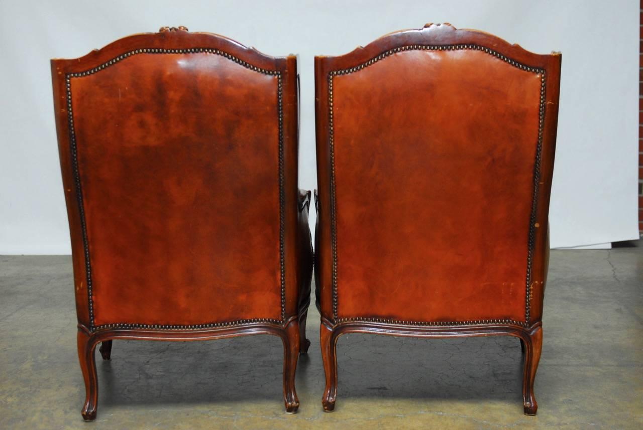 Brass Pair of Louis XV Tufted Cognac Leather Wingbacks