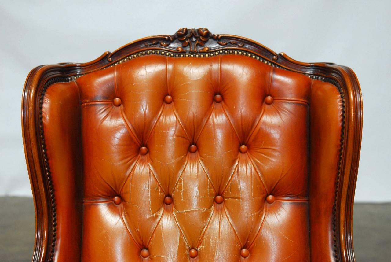 20th Century Pair of Louis XV Tufted Cognac Leather Wingbacks