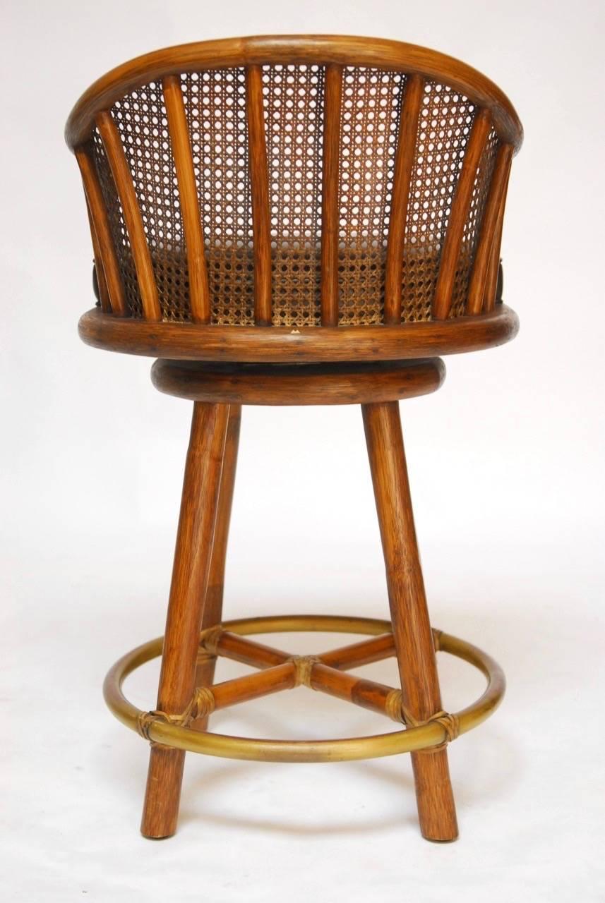 20th Century Set of Four McGuire Bamboo and Cane Swivel Barstools