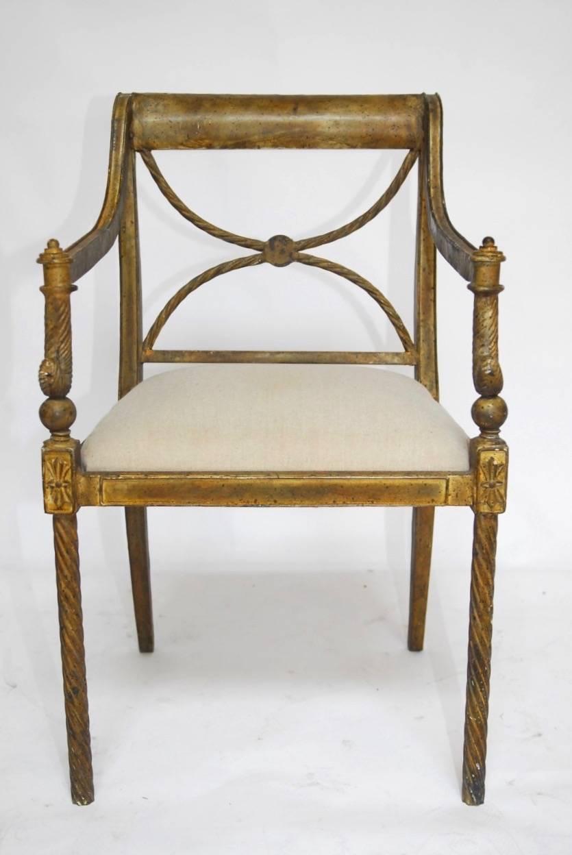 Impressive metal neoclassical style faux-rope armchair made in the Regency taste. Features a metal frame decorated with a twisted rope accented back splat and arms. The crest rail is scrolled and the chair is supported by faux rope legs in the front