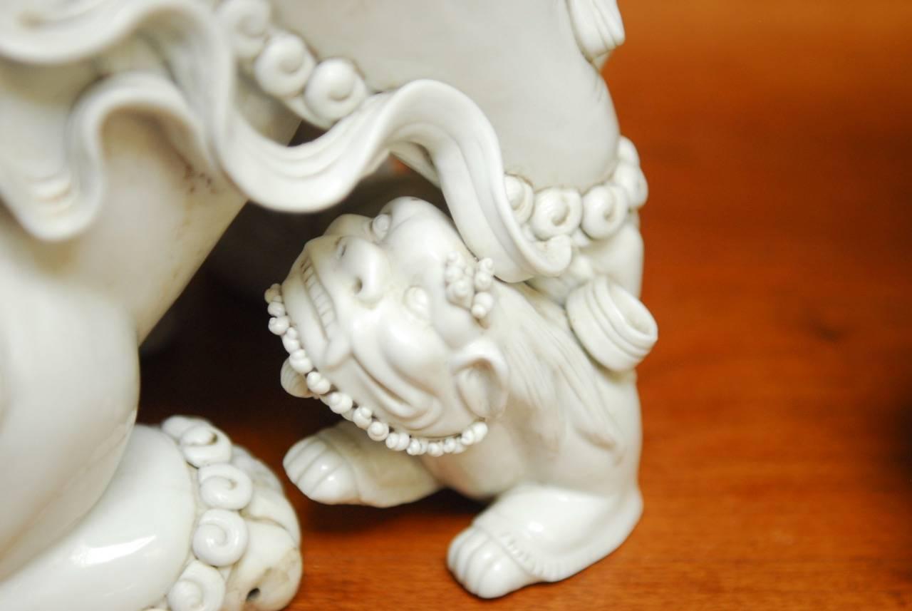 Pair of Chinese Dehua Blanc de Chine Porcelain Foo Dogs In Excellent Condition In Rio Vista, CA