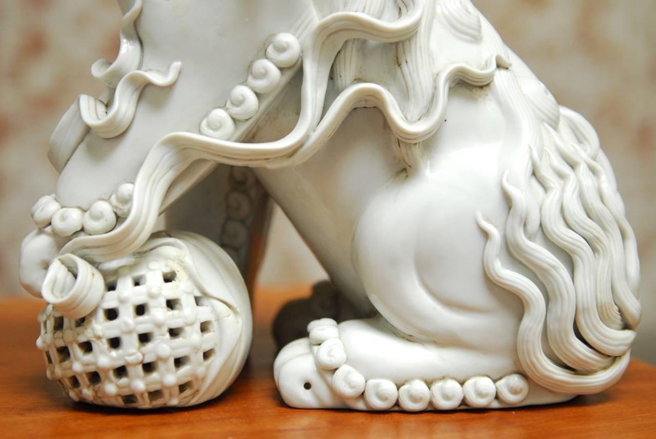 20th Century Pair of Chinese Dehua Blanc de Chine Porcelain Foo Dogs