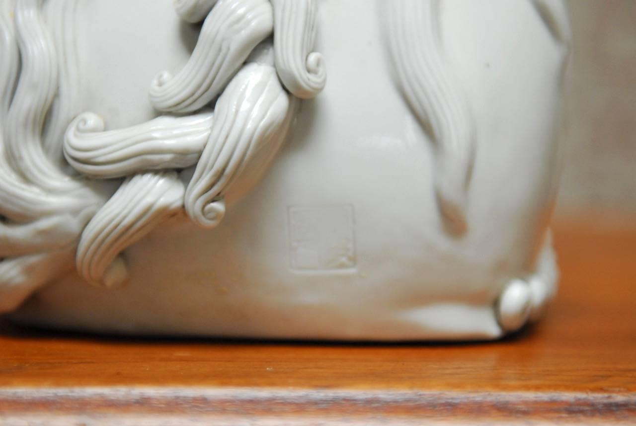 Pair of Chinese Dehua Blanc de Chine Porcelain Foo Dogs 2