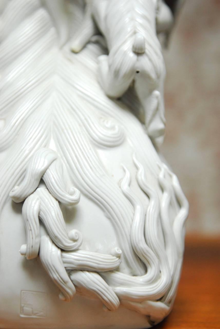 Pair of Chinese Dehua Blanc de Chine Porcelain Foo Dogs 3