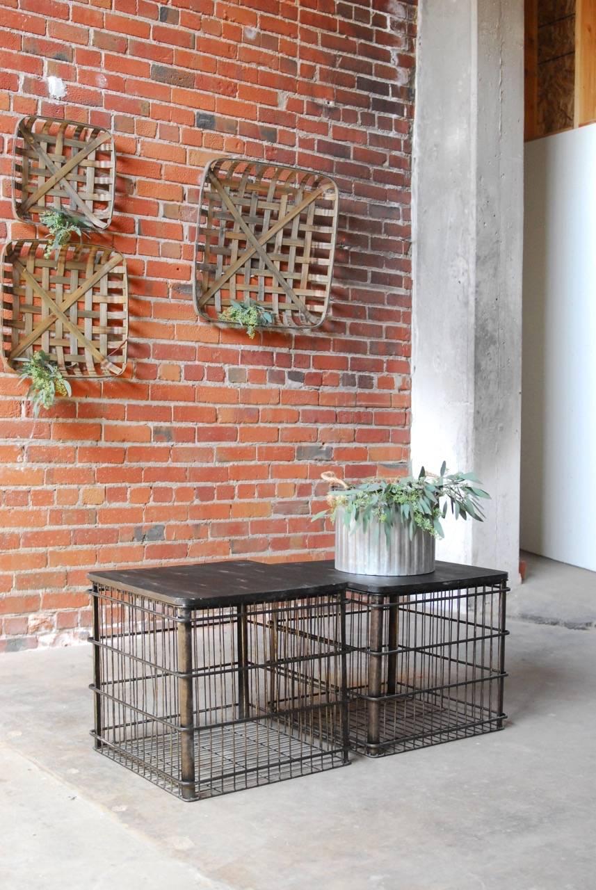 Pair of Industrial shipping bin side tables or drink tables with wood tops and metal cage bases. Tables vary in height by 1". The wooden top of each bin is removable and the bins can be used for display inside the metal cage.