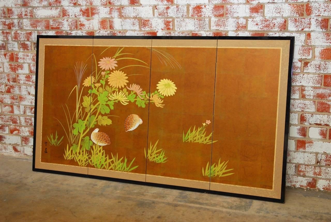 Beautiful Japanese four-panel Byobu screen featuring Japanese quail and spring flowers on a gilt background. Set with a silk brocade border in an ebonized wood frame. Signed and sealed on left side.