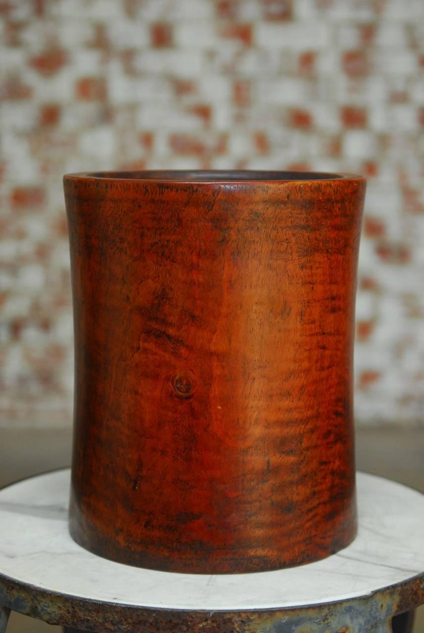 Rare and unusual 19th century monumental Chinese rosewood brush pot carved from a large, solid trunk. Beautiful crafted with a subtle hourglass cylindrical shape. Featuring rich and complex grain patterns. Weighs nearly 15 pounds.