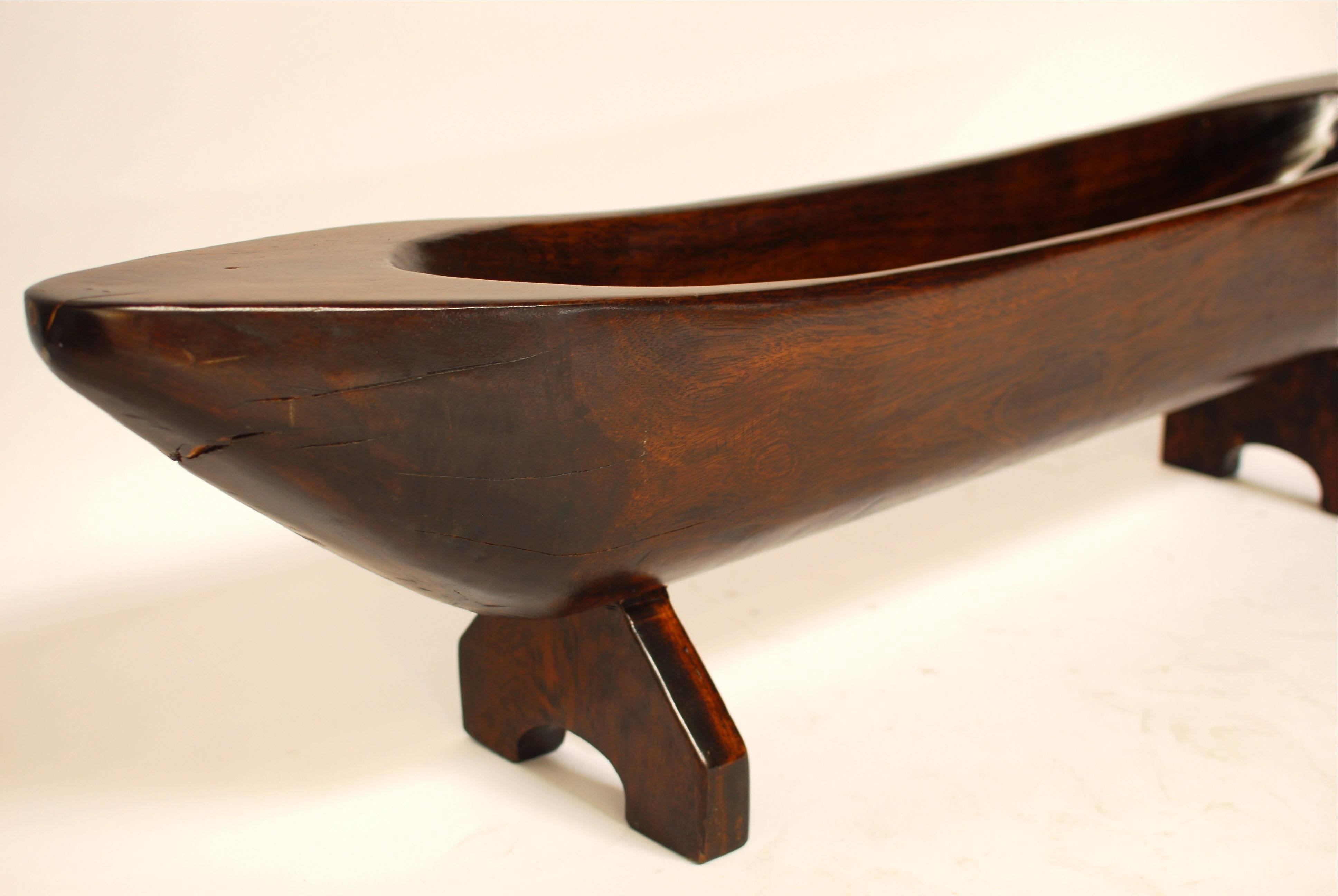 Monumental vintage carved wood display centerpiece of a large nautical shaped trough on stand. This massive display piece could be used to hold bread or fruit on the kitchen table, or use it as a sculptural piece in any area of the house. Very