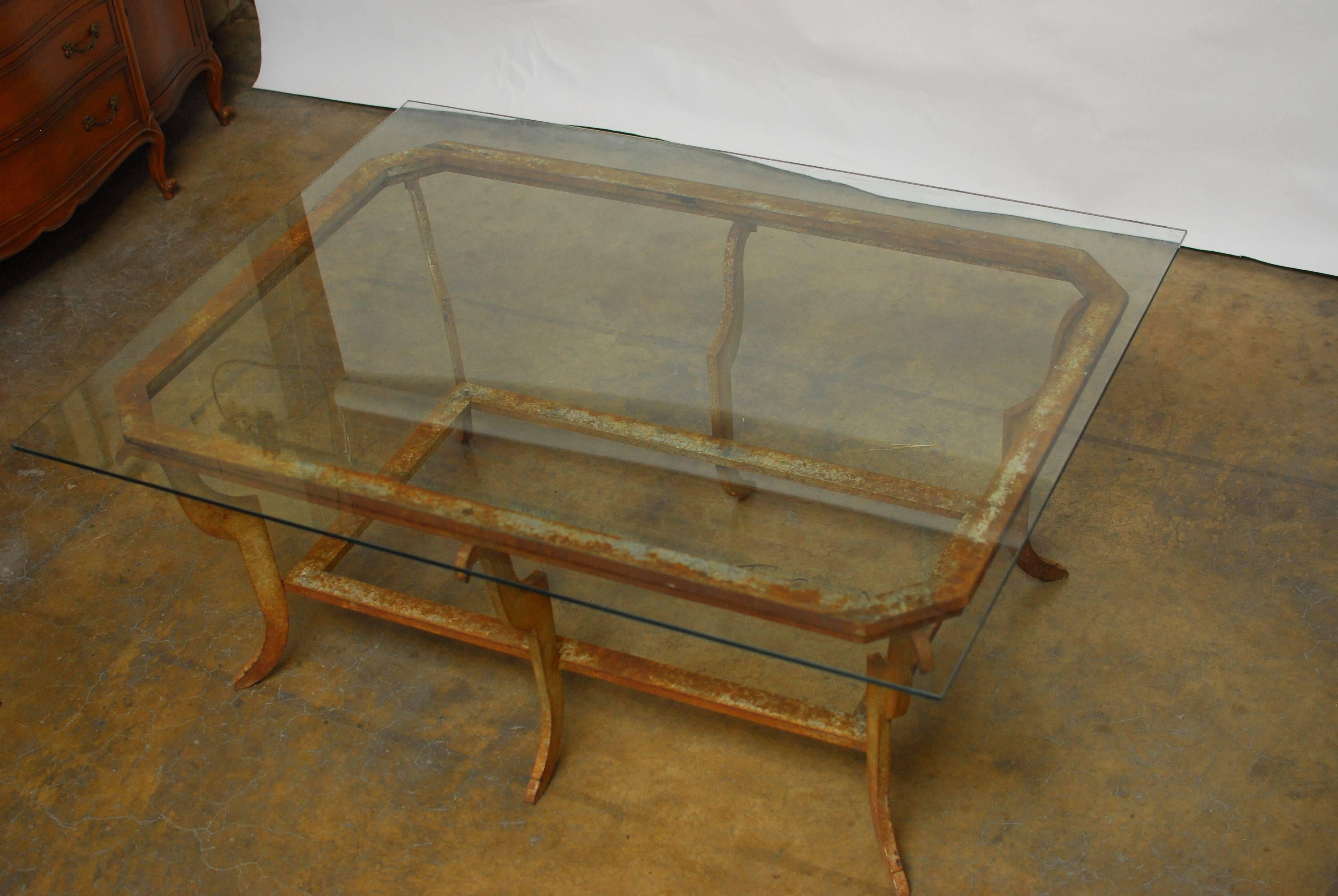 Large sculpted steel metal and glass coffee table constructed of six saber form legs joined by 2