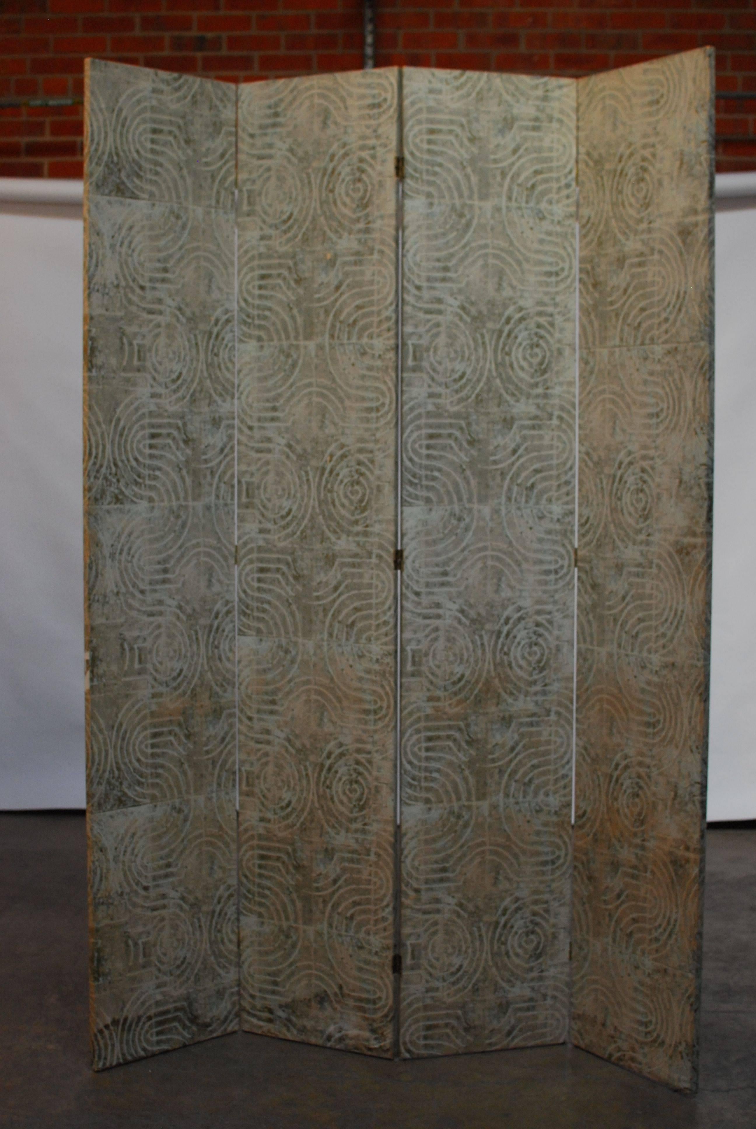 Chic four-panel folding Art Deco wallpaper screen featuring a geometric pattern over a delicate gilt background. Elegant modern age shapes decorate this impressive screen with subtle colors of light bamboo green. The panels have a lovely rich patina.
