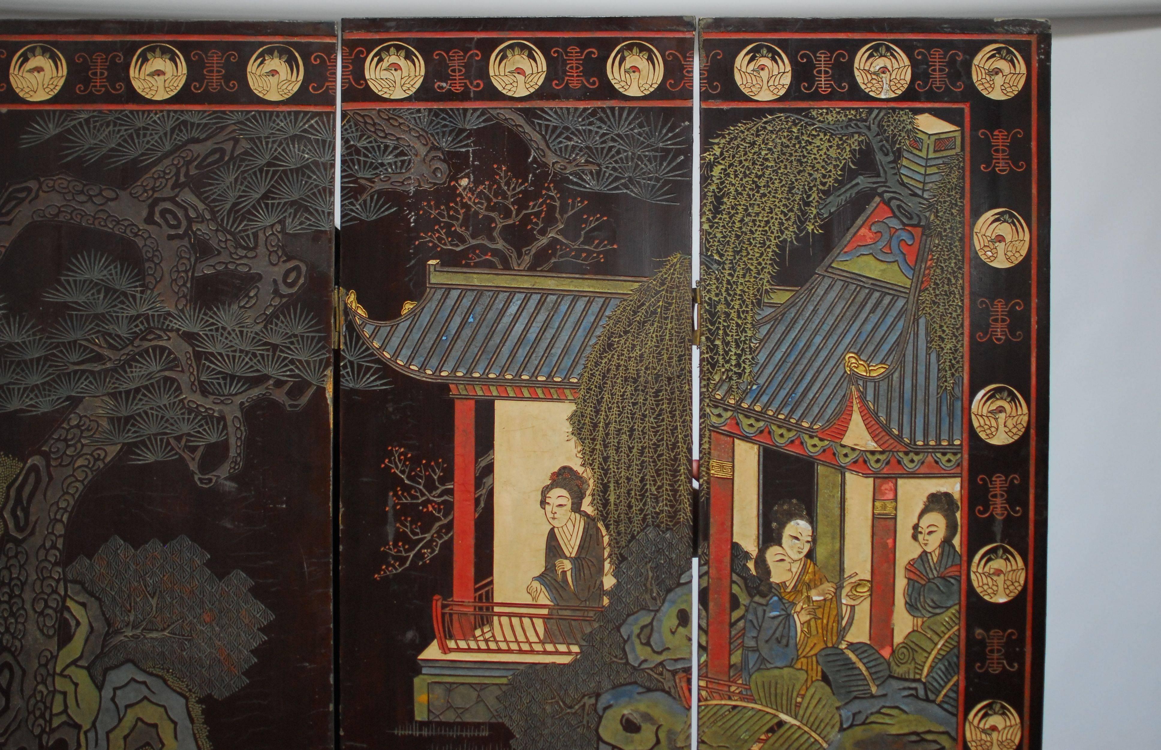 4 panel Chinese Coromandel folding screen depicting Imperial court ladies and colorful pagodas with a border of white cranes. The reverse side is decorated with cranes and trees. Older screen with lovely faded lacquer patina and major losses on the