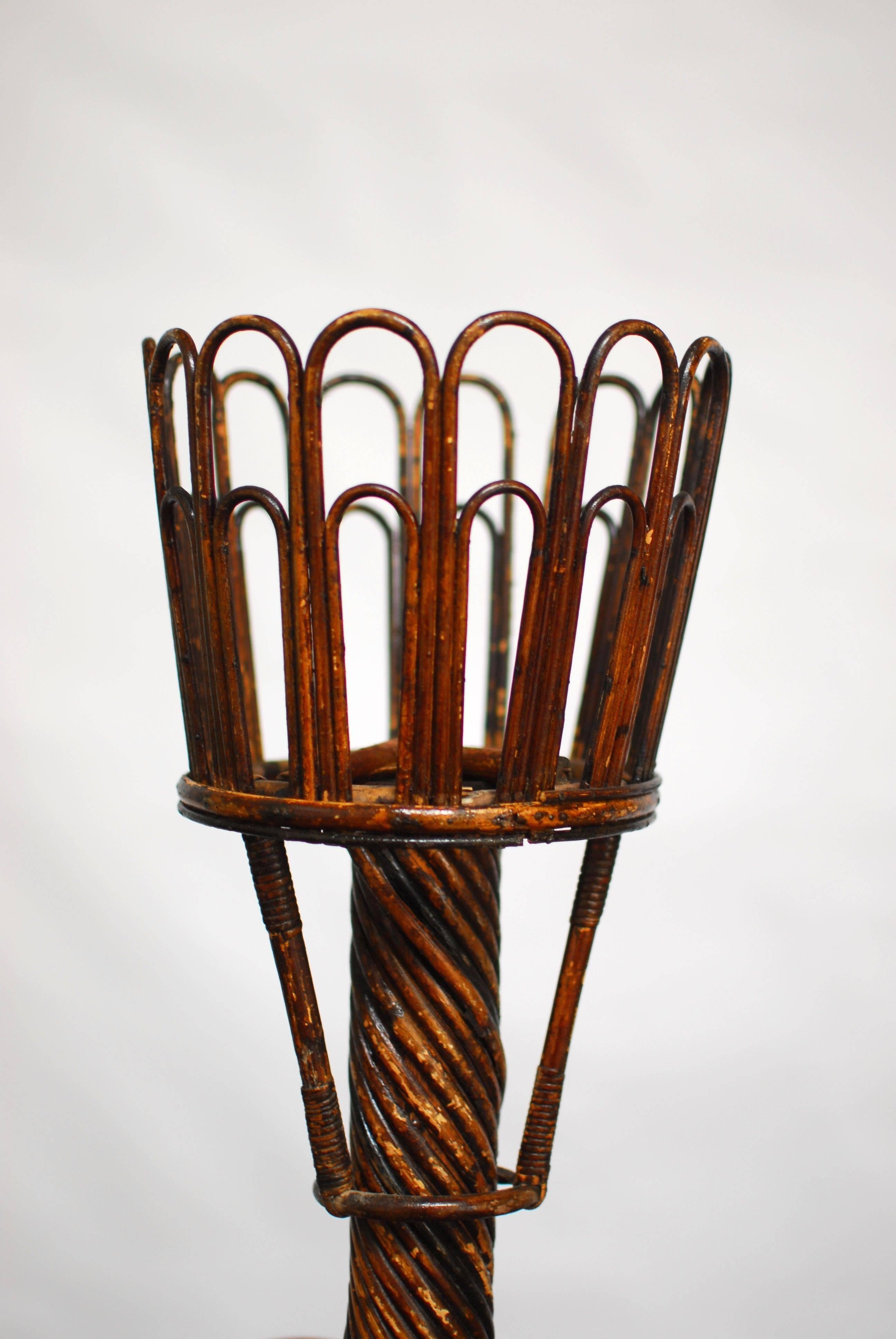 Bamboo rattan two tier plant stand made in the Art Nouveau style. Constructed with a tripod base and decorated with whimsical round rings on the base and shelf. From the Pennsylvania Estate of billionaire banking heir Richard Mellon. Bottom tier 