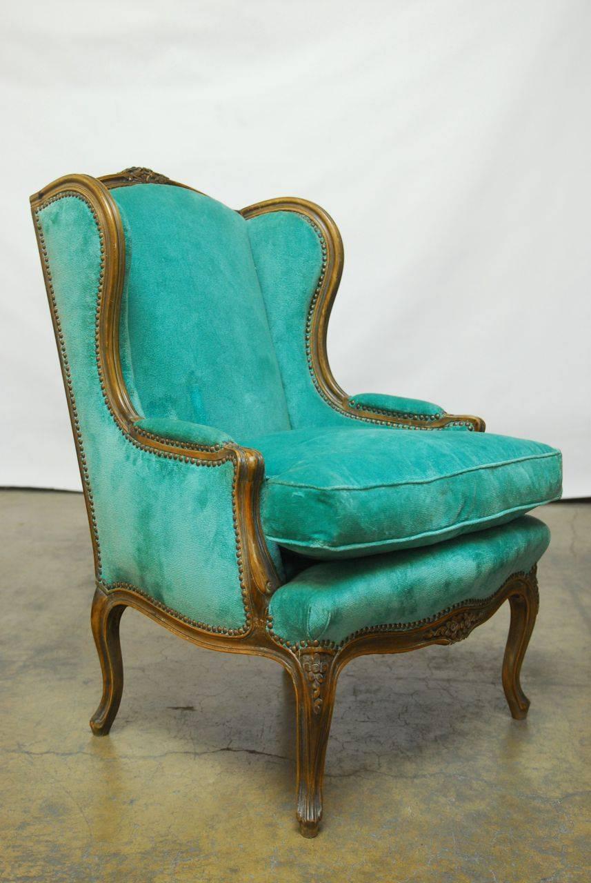 Hand-Carved Pair of Louis XV Style Turquoise Velvet Wingback Bergères