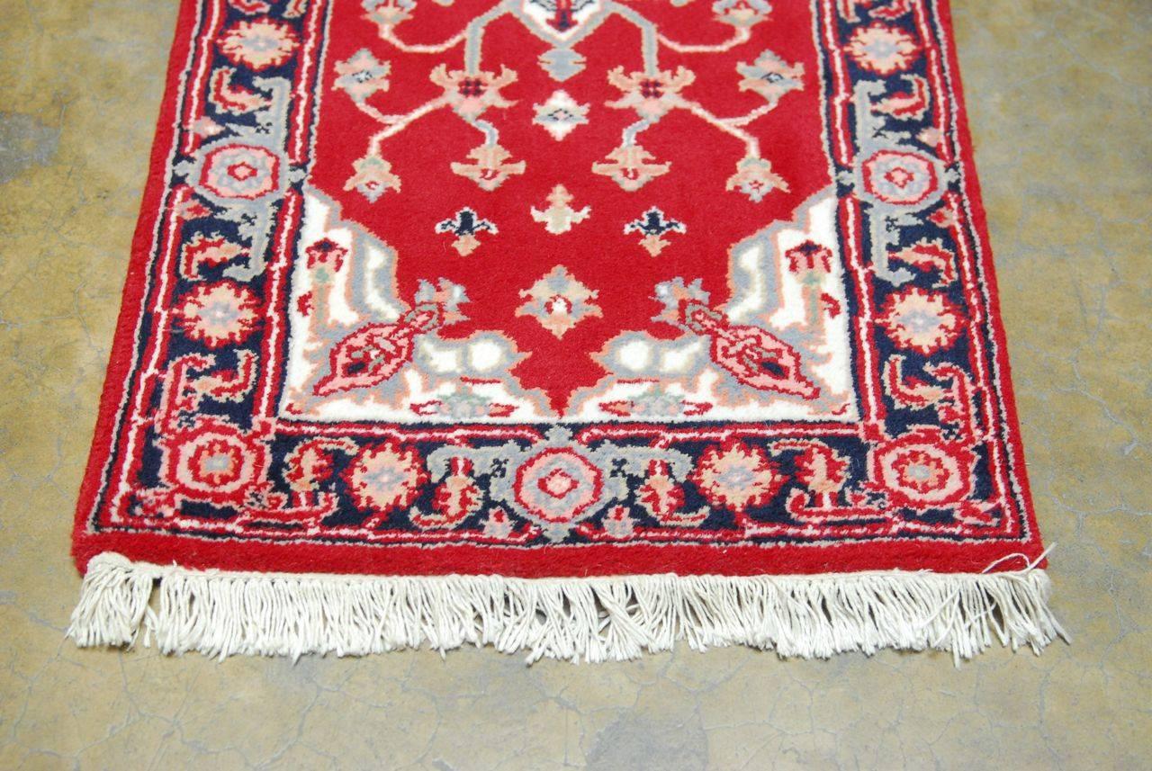 Persian Hamadan rug made of a thick wool pile and hand knotted. Beautiful vibrant patterns on a red ground with a single medallion.
