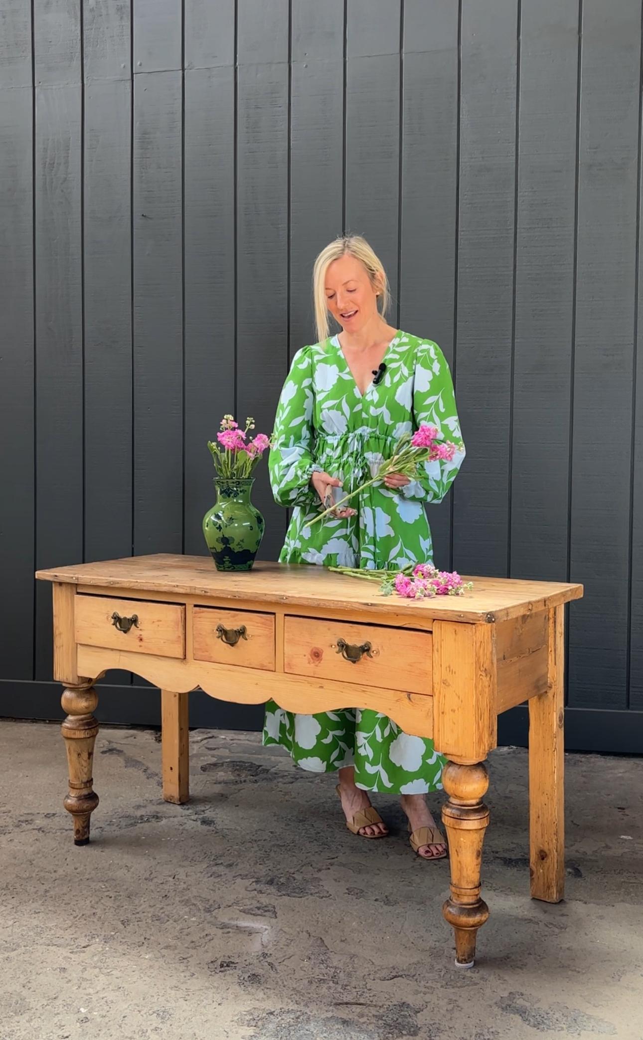 Beautifully weathered 19th century country English provincial dresser base or console table crafted from pine. The table is fronted by three large storage drawers above a serpentine apron. The pine has a desirable aged, distressed patina in a warm