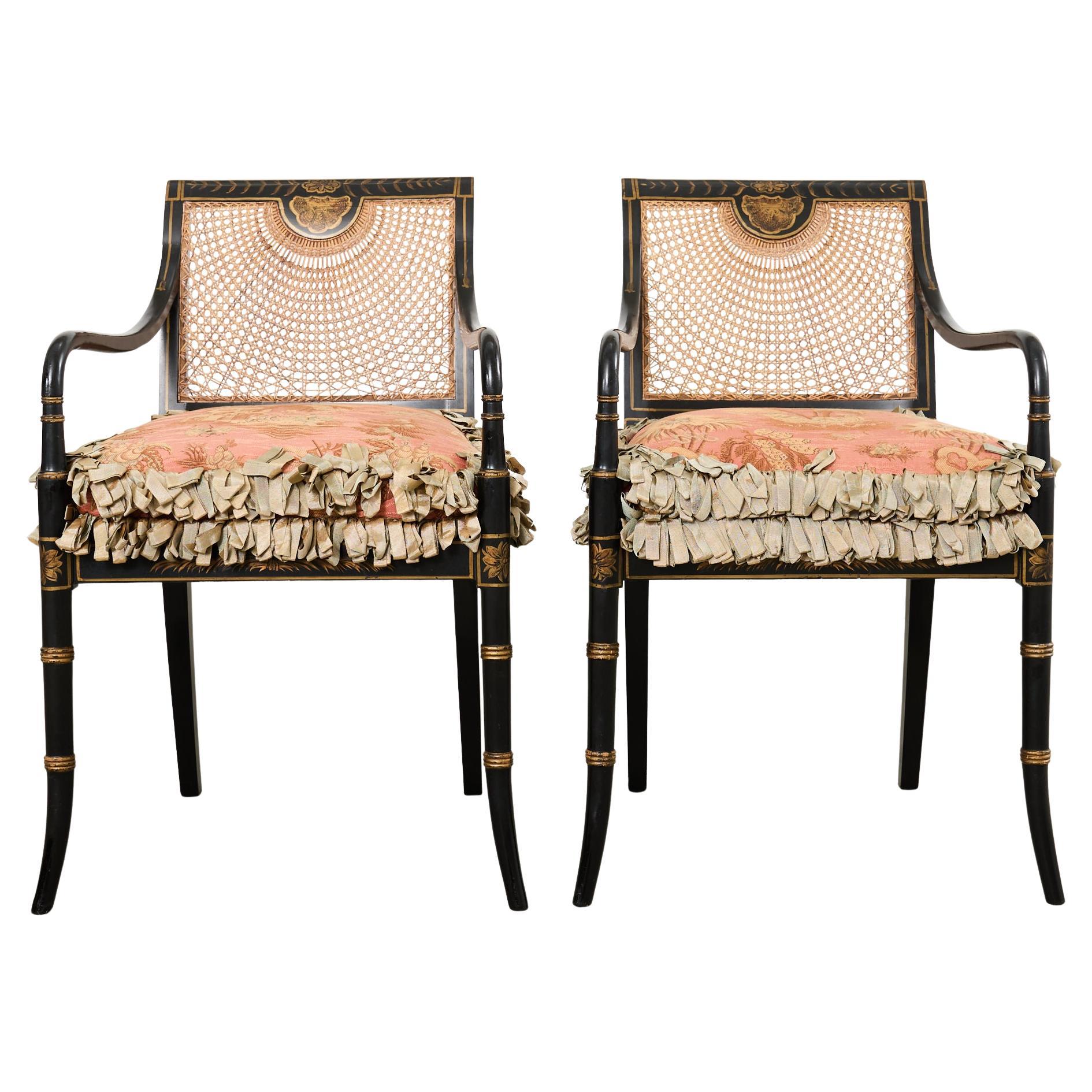 Pair of English Regency Style Ebonized Caned Elbow Chairs For Sale