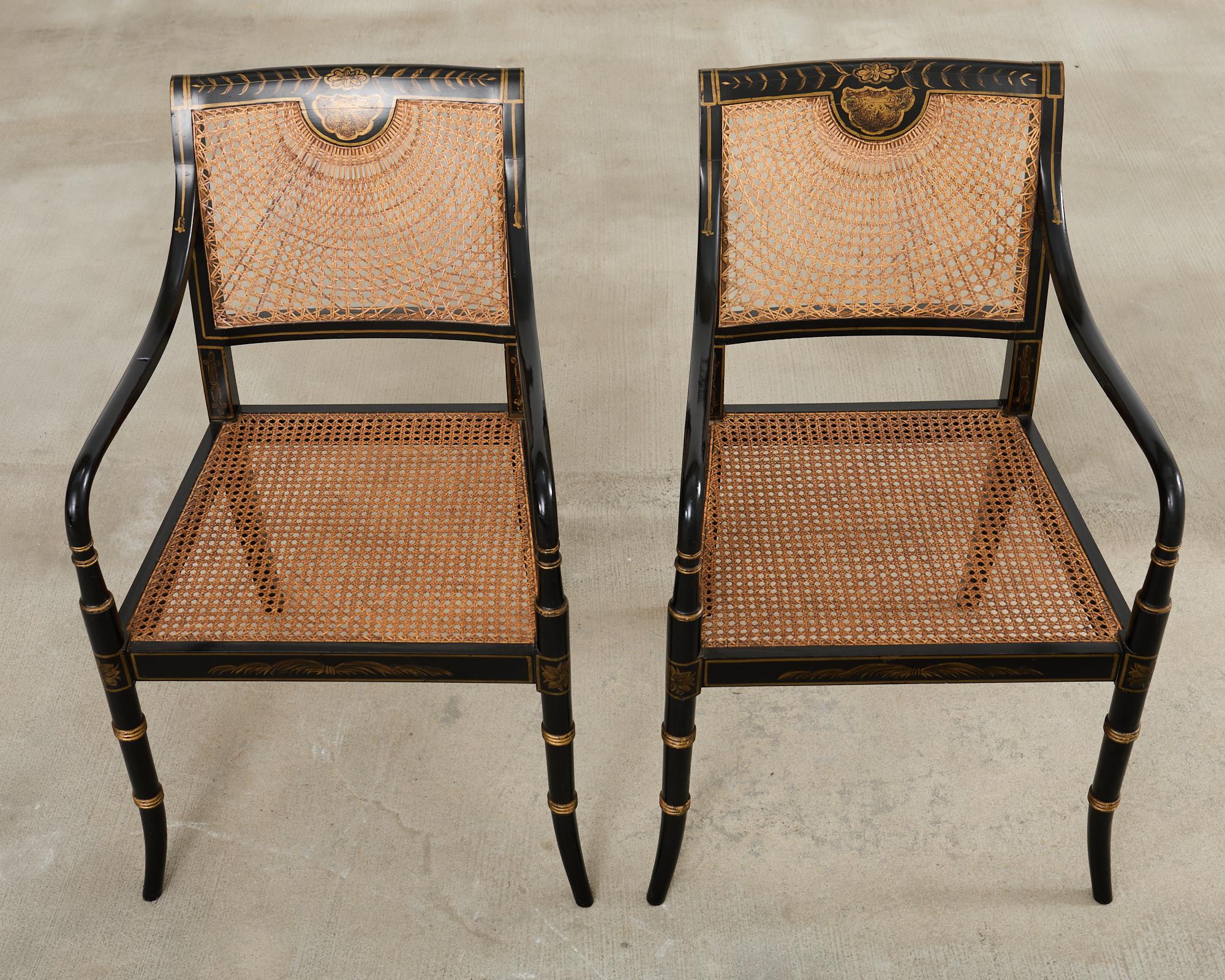 20th Century Pair of English Regency Style Ebonized Caned Elbow Chairs For Sale
